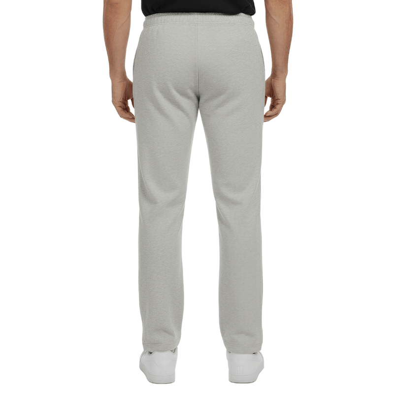 Pantaloni da jogging grigi con vita elastica e cuciture discrete, visti da dietro su una persona