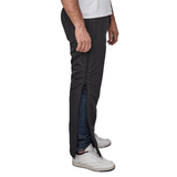 Vista laterale di pantaloni termici Dobsom neri con la cerniera a tutta lunghezza parzialmente aperta